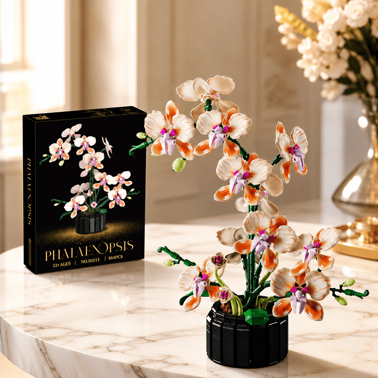 Phalaenopsis Orchid Building Set box beside a built orange and white orchid model